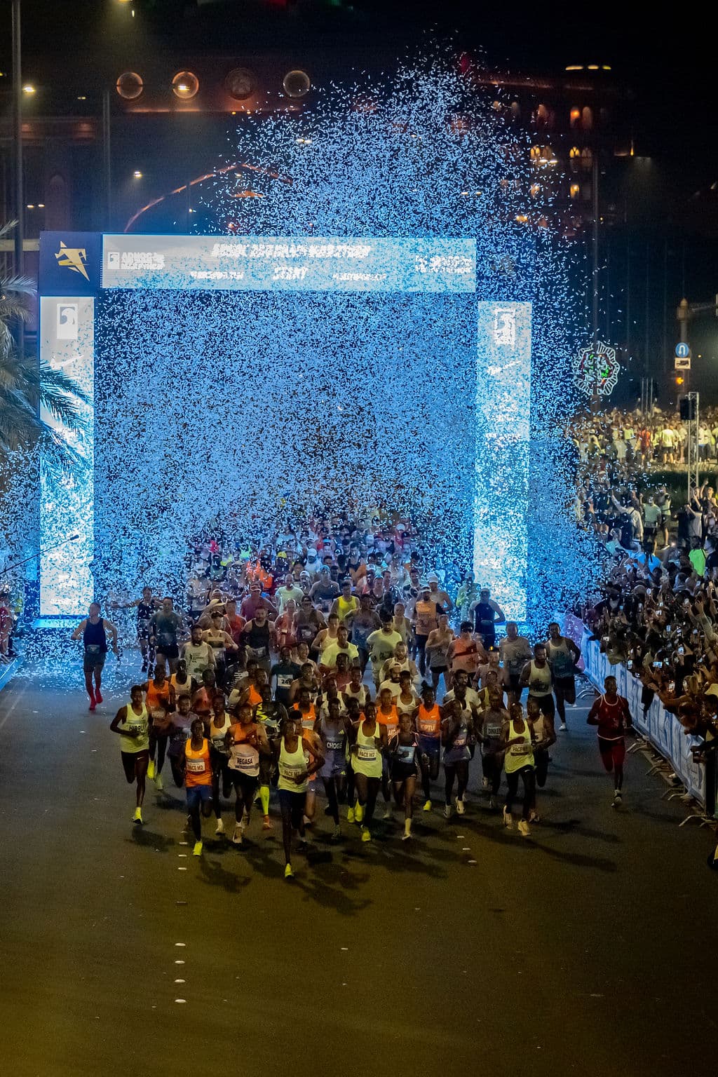 The mass start of the ADNOC Abu Dhabi Marathon at night
